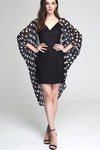 Model wearing black chiffon kimono with hearts & circles facing front